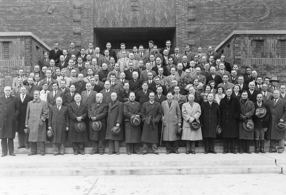 Faculty, Army Specialized Training Program, December 9, 1942, first row, left to right, James Hiram Graham, Hume Bedford, ?, O. T. Koppius, William S. Webb, O. J. Stewart, ?, Lester O'Bannon, ?, ?, Paul P. Boyd, President Herman L. Donovan, H. H. Downing, J. C. Earls, ?, Daniel Terrell, second row, behind / between Webb and Stewart, Marion Brown, Professor of Math, behind / right of O'Bannon, C. G. Latimer, behind Donovan, Lydia R. Fisher, behind / between Downing and Earls, Sallie Pence, Professor of Math, right of her, E. A. Bureau, behind Terrell, Charles Anderson, back and to left of Lydia Fisher, Flora Le Stourgeon, Professor of Math, 1920 - 1946, behind Sallie Pence, Steven Crouse