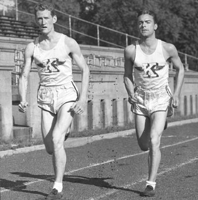 Track, two runners in action, 1941