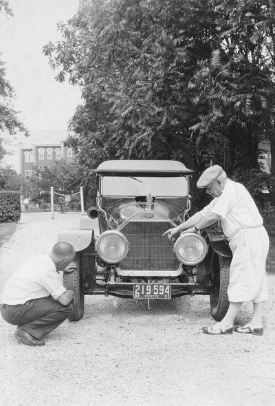 Anderson, F. Paul, Dean of Mechanical Engineering, 1892 - 1918, Dean of Engineering, 1918 - 1934, right and unidentified man examining a car