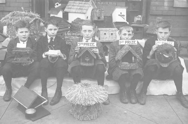 Lincoln School, young men with birdhouses