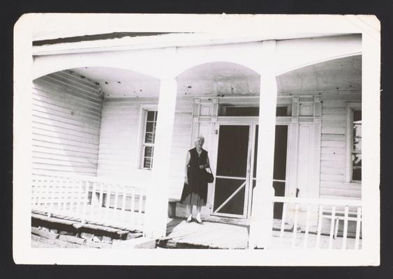House on Jack's Creek Road, Madison County, Kentucky. Woman in photo is [Anne G. Brink ?]