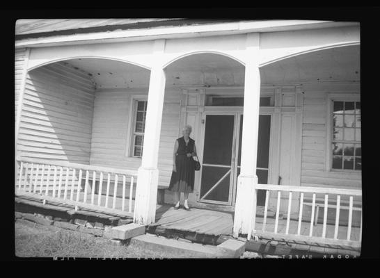 House on Jack's Creek Road, Madison County, Kentucky. Woman in photo is [Anne G. Brink ?]