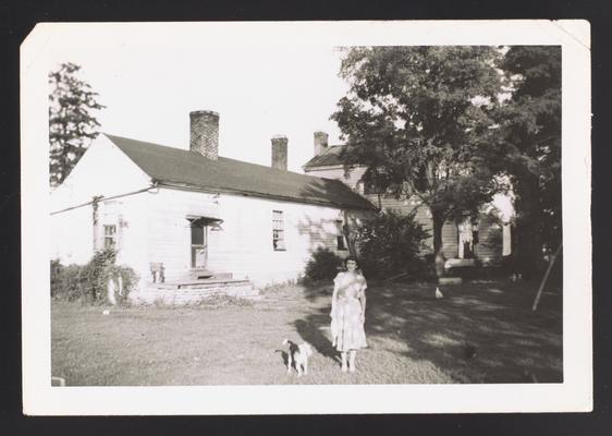 View of elle of a house on Redd Road, Fayette County, Kentucky. Iva Dagley pictured in photo
