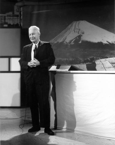 Man on studio set, speaking to camera (Dr. George Brady, taught for WLEX-TV)
