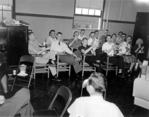 Class Social: Students in classroom laughing and applauding (Wes Strader, Ralph Albers, Gil Levitch, Donna Reed)