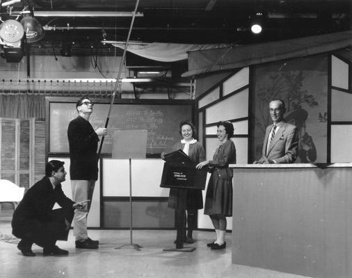Television studio set for Dr. Arthur L. Cooke's Survey of English Literature course: L to R: Ronald Russel-Tutty, Robert (Bob) Cooke, Jonelle Simmons, Kathryn White and Dr. Arthur L. Cooke (Duplicate of #210)