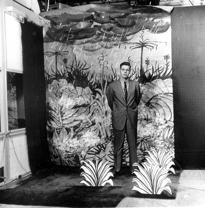 Dr. Doug Schwartz standing in front of painted backdrop