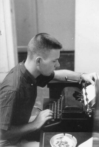 Young man at typewriter