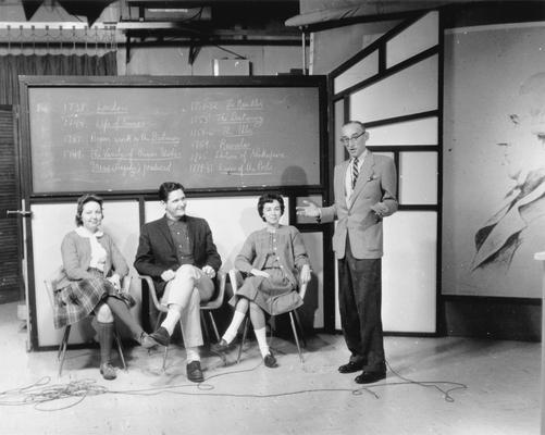 Three students (Kassie Roper?) sitting during taping of Dr. Arthur L. Cooke's English Literature course