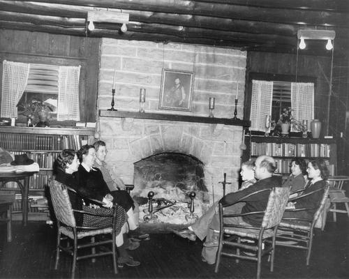People gathered around a fireplace