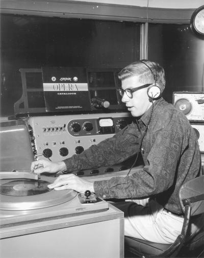 Student at turntable, playing music from the 