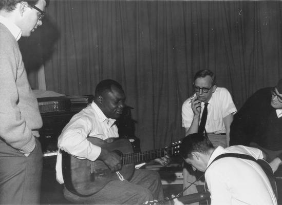 African-American man playing guitar