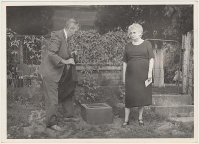 Man and woman unveiling the marker on the ground (August 13, 1961). The lady in the center is Mrs. Pearl Day Bach