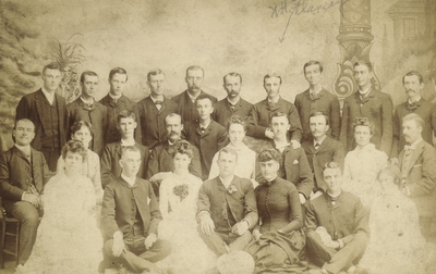 Group photo of twenty young men and seven young women including W. H. Flanery