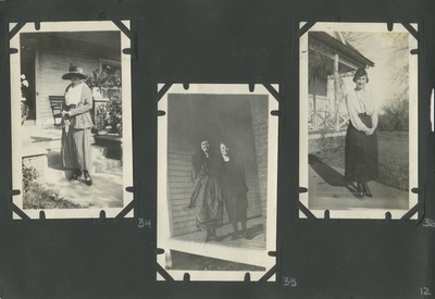 woman standing at the bottom of what appear to be porch steps; 2 women standing on the porch of a house; woman standing on walk way to house