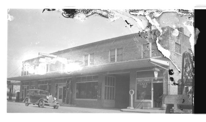 Negative of unknown building with multiple stores