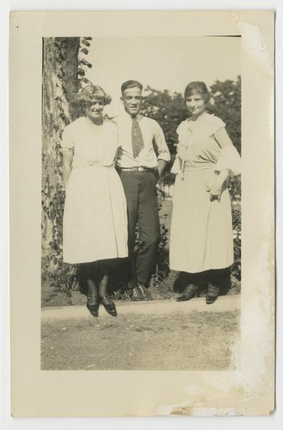 Unidentified man and two women