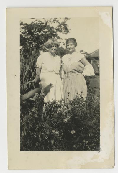 Two unidentified women in a garden