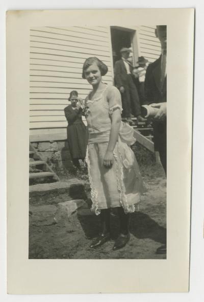 Unidentified young woman in a ruffled dress