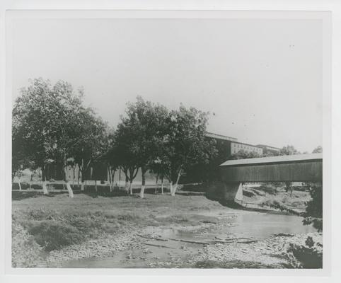 Warehouses; covered bridge over creek