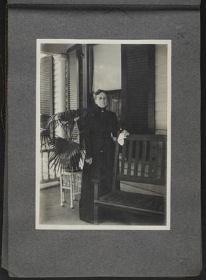 Woman on porch in black