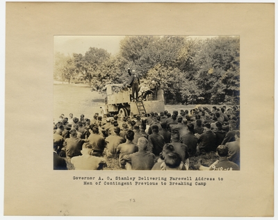 Governor A. O. Stanley delivering farewell address to men of Contingent previous to breaking camp
