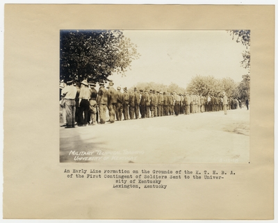 An early line formation on the grounds of the K.T.H.B.A. of the First Contingent of Soldiers sent to the University of Kentucky. Lexington, KY