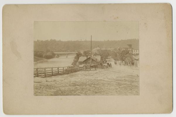 View of Frankfort and the Kentucky River with horse, buggy and bridge; View from Arsenal Hill of Frankfort KY taken by Paul, Sept. 1886 written on back in ink