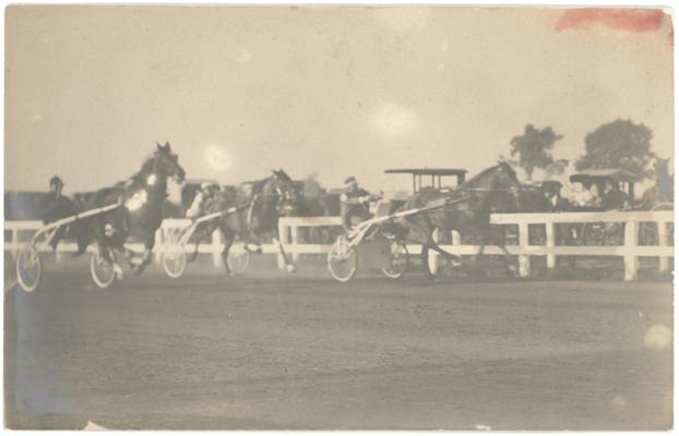 [Image of a trotting race. Handwritten note on verso indicates the location is the Lexington Trotting Track and that the card is from the Margaret P. Johnston Papers, 1960] [Horses]