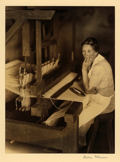 Miss Roselie Pless; Russelville, Tennessee.  Woman in apron, seated at loom