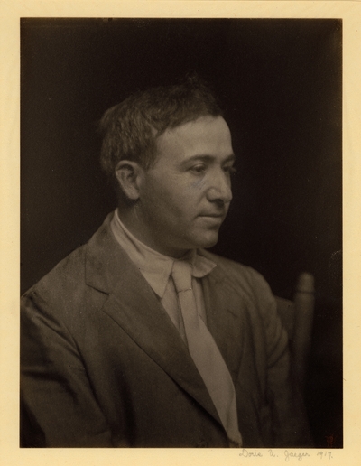 Max Weber, Ulmann's Art and Design teacher at the Clarence H. White School of Photography, New York City, 1917.  Head shot of man (artist) in coat and tie, seated in chair