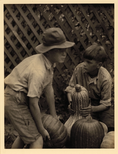 Two boys with squashes