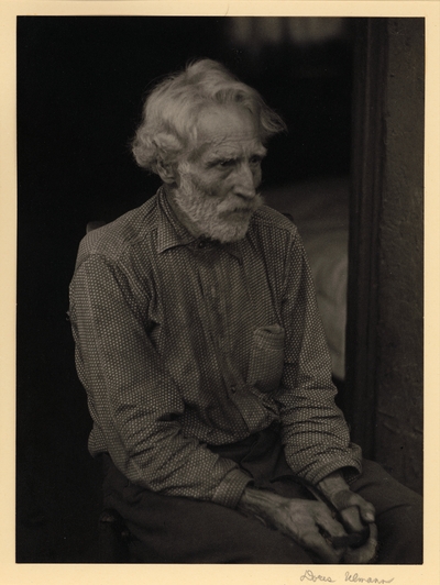 Nick Barton, Civil War veteran, d. May 1928.  Bearded man in polka-dot shirt, seated in chair, holding pipe