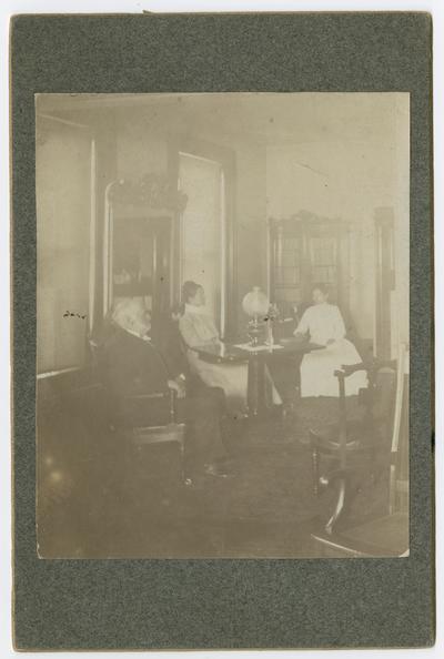 Linda Neville (right side) in our parlor at our home on West Mail Street--in the house built after 1895 also pictured: John Henry Neville and Ma Neville