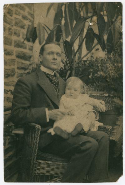 Male, unknown, with infant