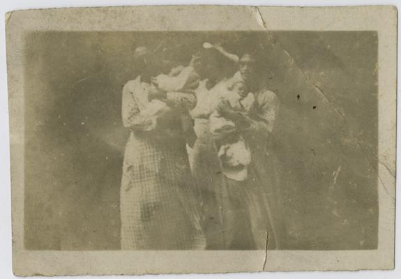 Patients, infants, unknown (being held by nurses)