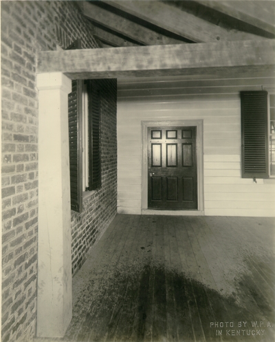 Exterior view of the rear porch looking to the front hall of the Ephraim McDowell House after renovation by the WPA.  Photos by the WPA with handwritten description on back of photo. 8x10
