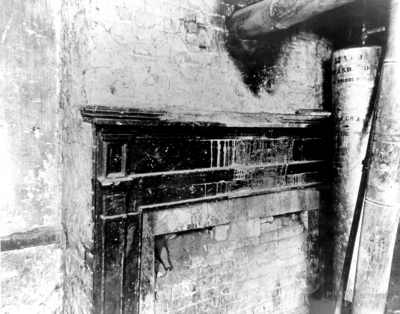 Interior view of the dining room fireplace of the Ephraim McDowell House prior to renovation by the WPA. Photos by the WPA with handwritten description on back of photo. 8x10