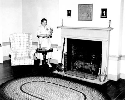 Photograph by the Lexington Herald-Leader an interior view of Mrs. Bullock in a bedroom above the living room in the Ephraim McDowell House.   Reprinted March 10, 1954. 8x10