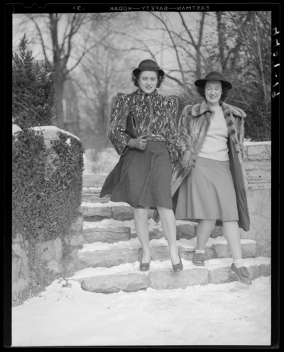 Campus views (1940 Kentuckian) (University of Kentucky); two                             women standing on stone steps