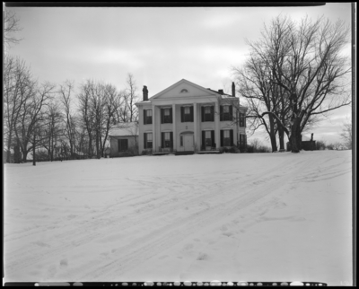 Mrs. Lawrence Simpson; exterior view of house and trees, snow                             covered