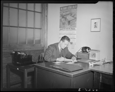 Man sitting at a desk, (1940 Kentuckian) (University of                             Kentucky)