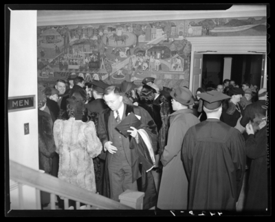 Commencement Exercises (1940 Kentuckian) (University of                             Kentucky); graduates and attendees gathered in a hall