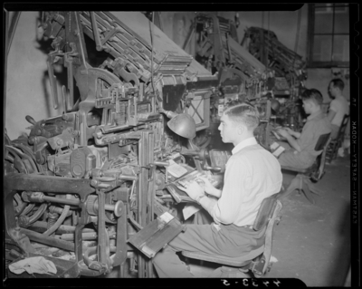 Print Shop, (1940 Kentuckian) (University of Kentucky); interior,                             operators keying text into printing press