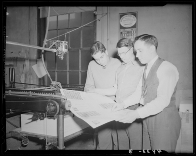 Print Shop, (1940 Kentuckian) (University of Kentucky); interior,                             three men standing next to printing press