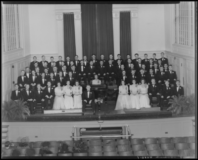 Men’s Glee Club, (1940 Kentuckian) (University of Kentucky); Glee                             club members on stage, dressed in formal attire