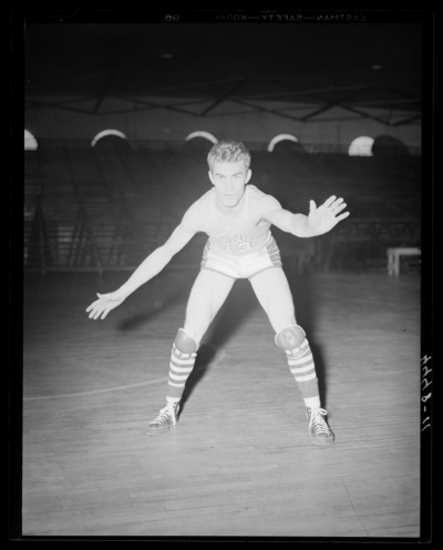 Varsity Basketball, (1940 Kentuckian) (University of Kentucky);                             interior, individual player on the court