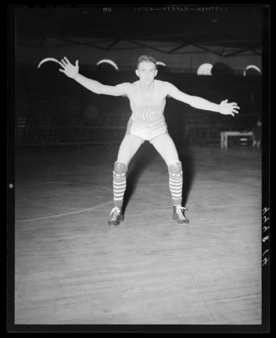 Varsity Basketball, (1940 Kentuckian) (University of Kentucky);                             interior, individual player on the court