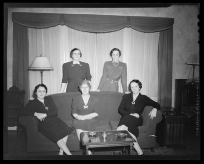 Mrs. Harold Williamson, Chas Turner; group of five women gathered                             around a sofa