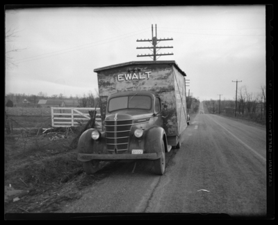 The Travelers Insurance Company; claim department, post-accident                             scene photograph; truck carrying a shipping containing parked along side                             of the road, container labeled 